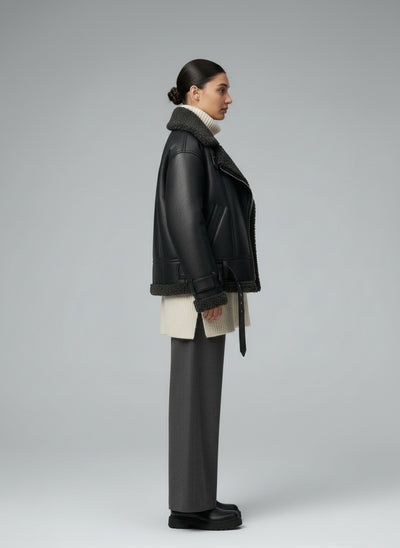 Side profile of the model wearing Elvira | Belted Shearling Coat