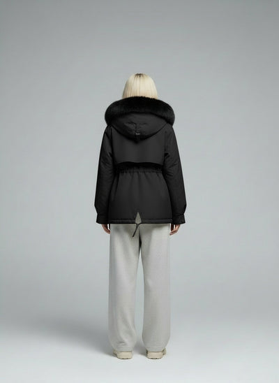 Back pose of the model wearing Marlen™ | Eleganter Wintermantel