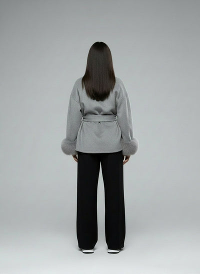 Back pose of the model wearing Linora Wollmantel