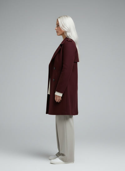 Side profile of the model wearing Amalia | Weinrot Trenchcoat